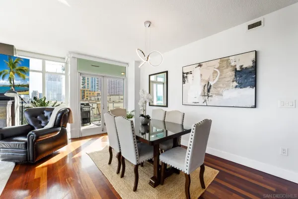 a view of a dining room with furniture window and wooden floor
