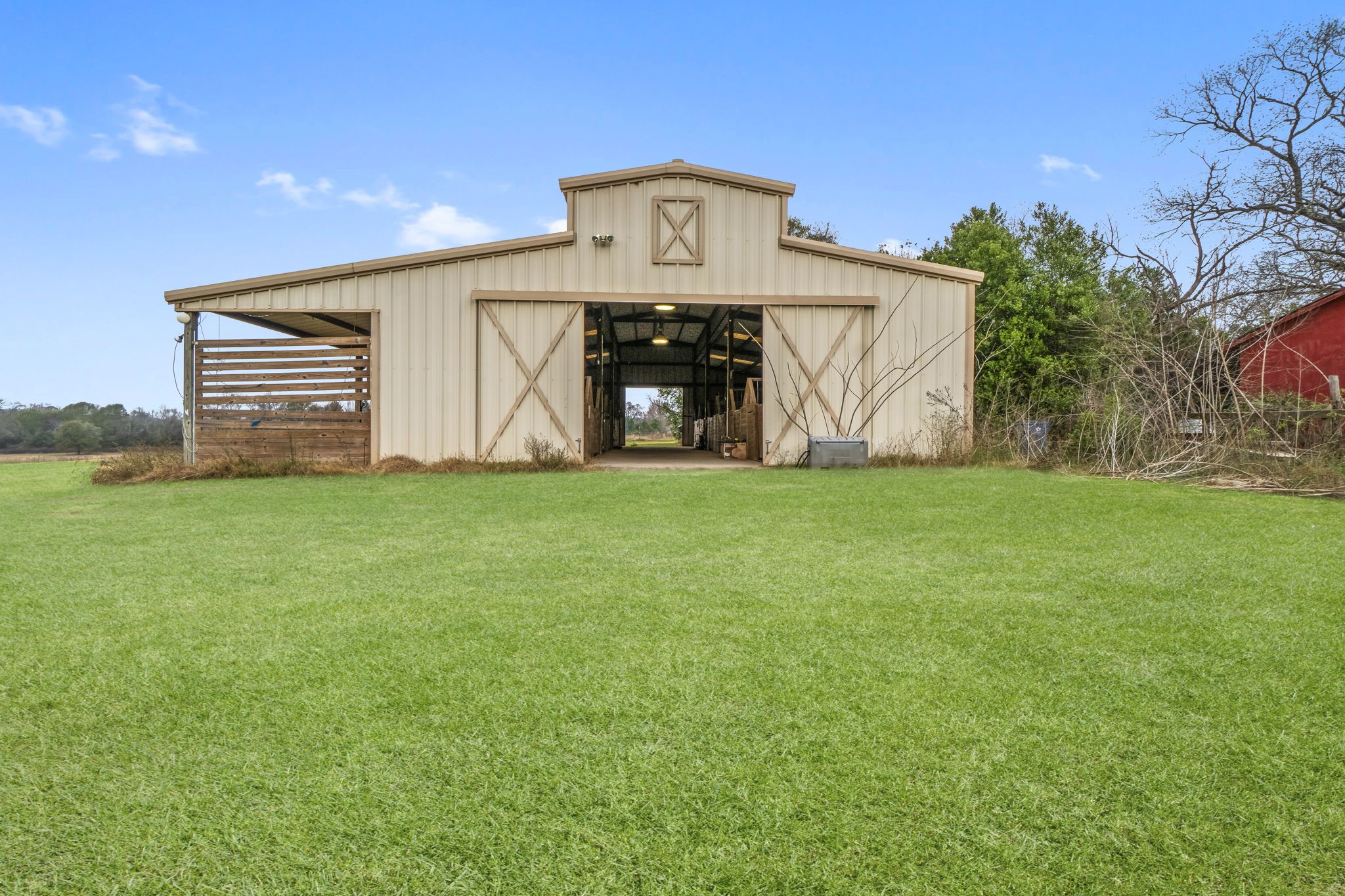 18226 FM 1484 Road Conroe, TX 77303 - Photo 6 of 13 12 stall horse barn with concrete aisle. This building could be converted into other uses.