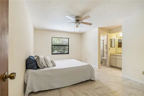 a bedroom with a bed and dresser