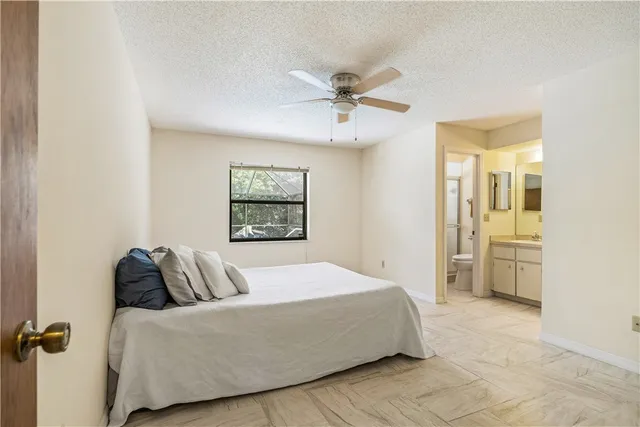 a bedroom with a bed and dresser