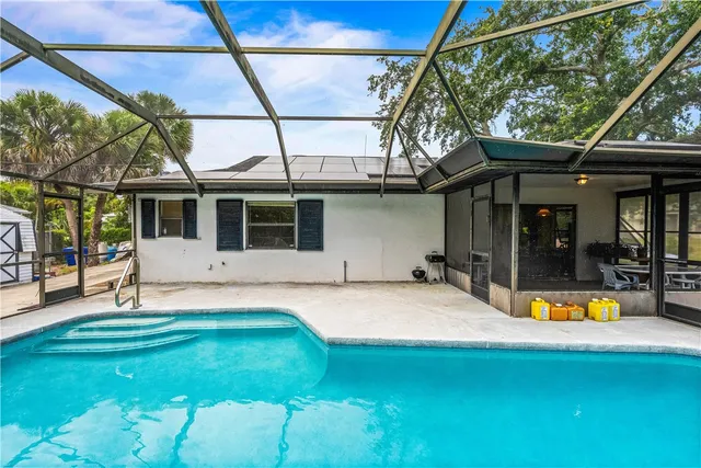 a view of a house with a swimming pool