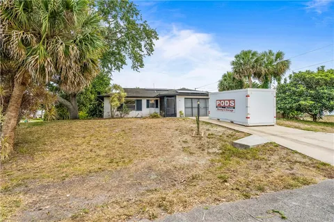 a house with trees in front of it