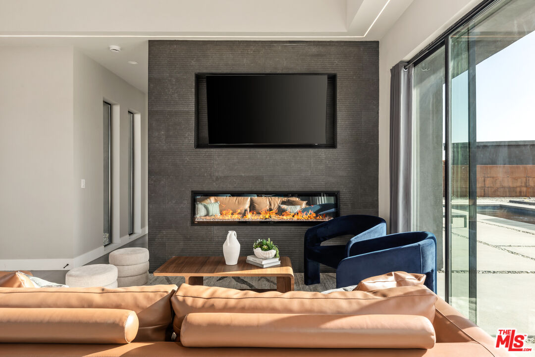 3000 Rockwood Road Joshua Tree, CA 92252 - Photo 52 of 71 a living room with furniture and a fireplace