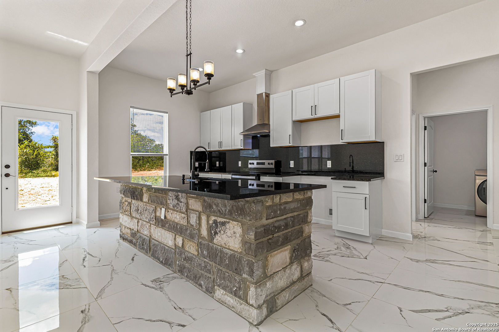 120 County Road 6852 Lytle, TX 78052 - Photo 15 of 36 a kitchen with stainless steel appliances granite countertop a stove a sink and a refrigerator