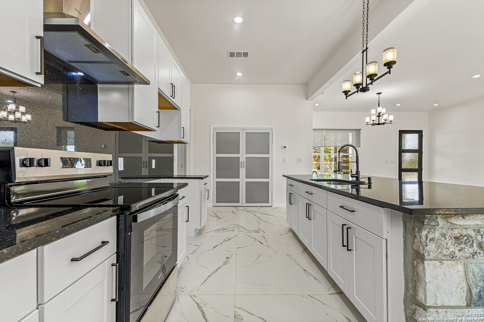 120 County Road 6852 Lytle, TX 78052 - Photo 16 of 36 a large kitchen with granite countertop a stove and a sink