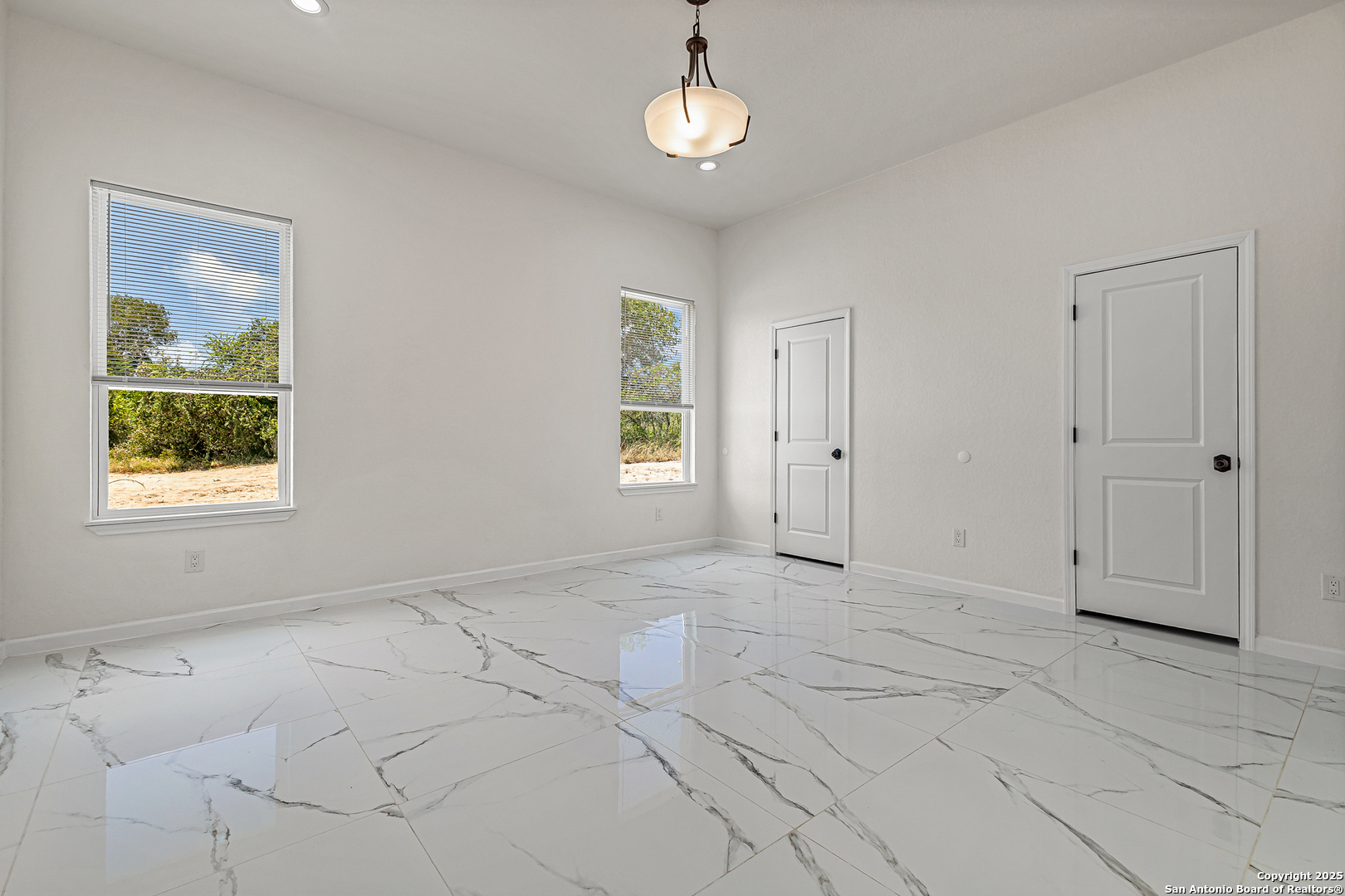 120 County Road 6852 Lytle, TX 78052 - Photo 18 of 36 an empty room with windows and closet