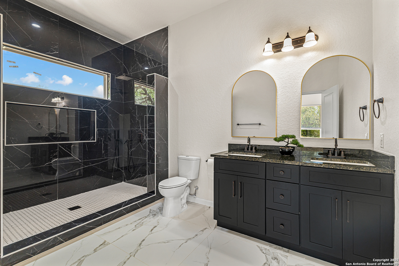 120 County Road 6852 Lytle, TX 78052 - Photo 20 of 36 a bathroom with a double vanity sink toilet and shower