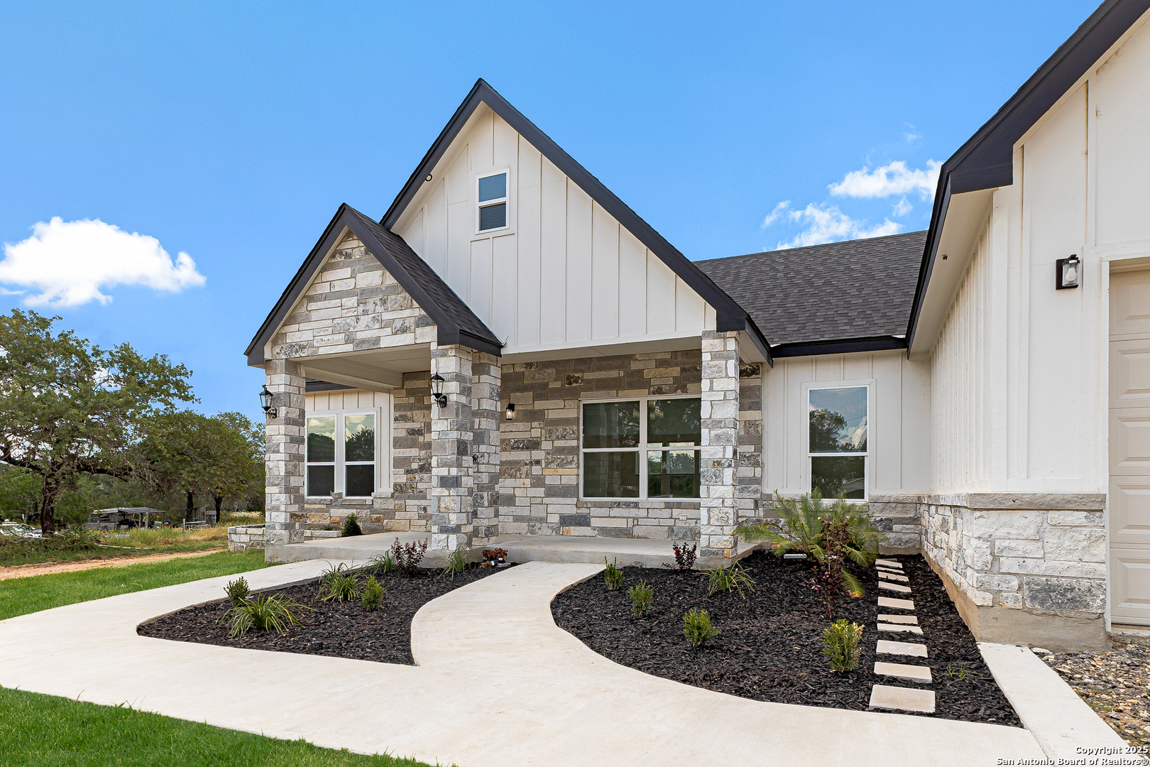 120 County Road 6852 Lytle, TX 78052 - Photo 2 of 36 a front view of a house with garden