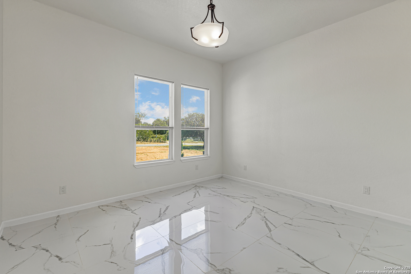 120 County Road 6852 Lytle, TX 78052 - Photo 23 of 36 an empty room with windows