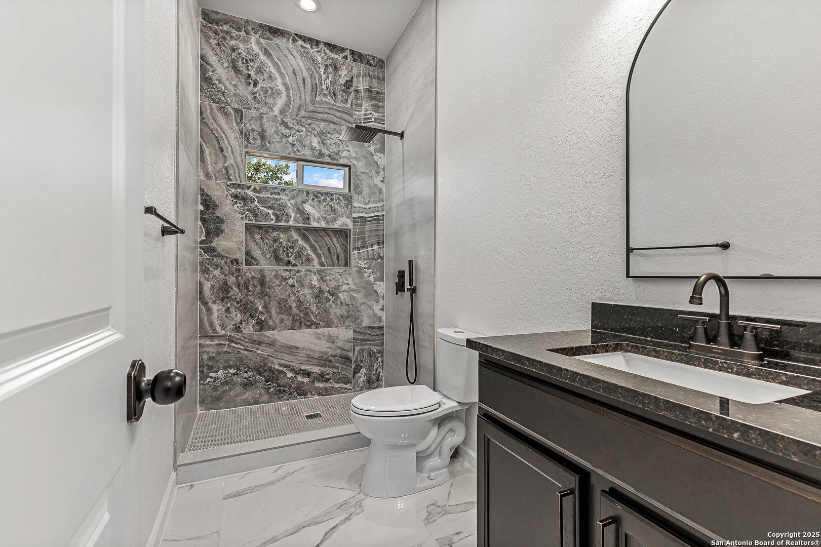 120 County Road 6852 Lytle, TX 78052 - Photo 24 of 36 a bathroom with a granite countertop sink toilet and shower