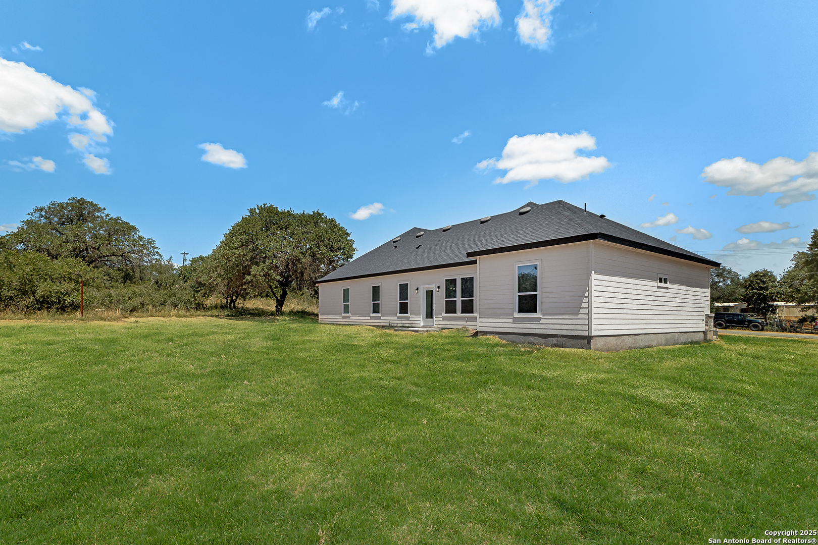 120 County Road 6852 Lytle, TX 78052 - Photo 33 of 36 a house view with a garden space