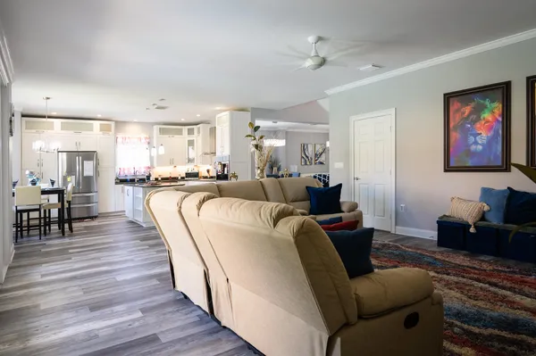 a living room with furniture and a rug