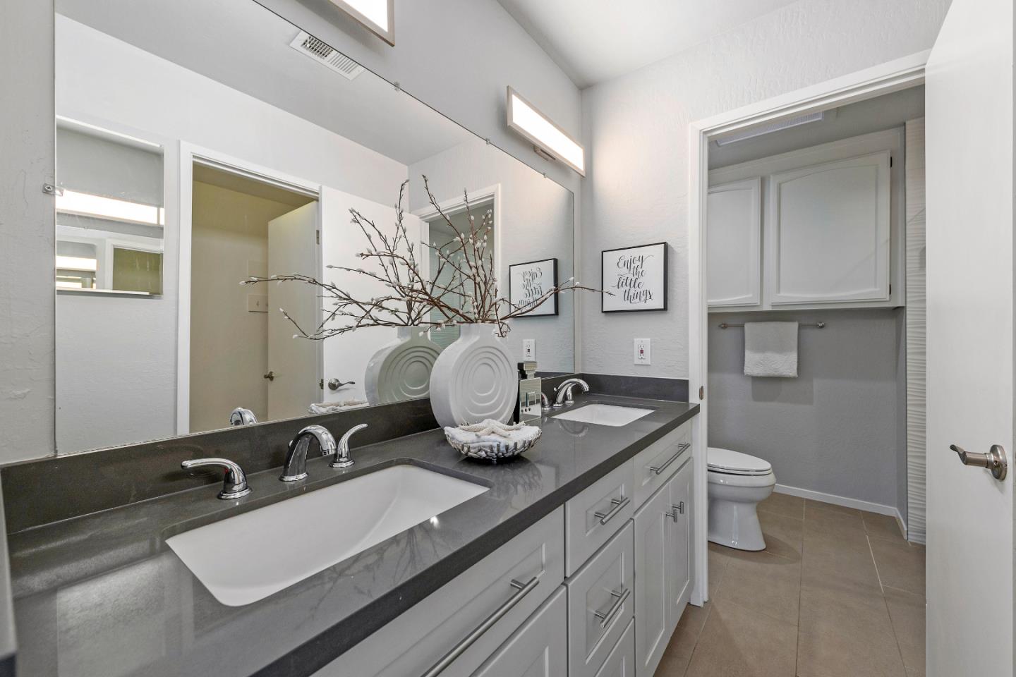 334 West Rincon Avenue Campbell, CA 95008 - Photo 15 of 25 a bathroom with a toilet sink and mirror