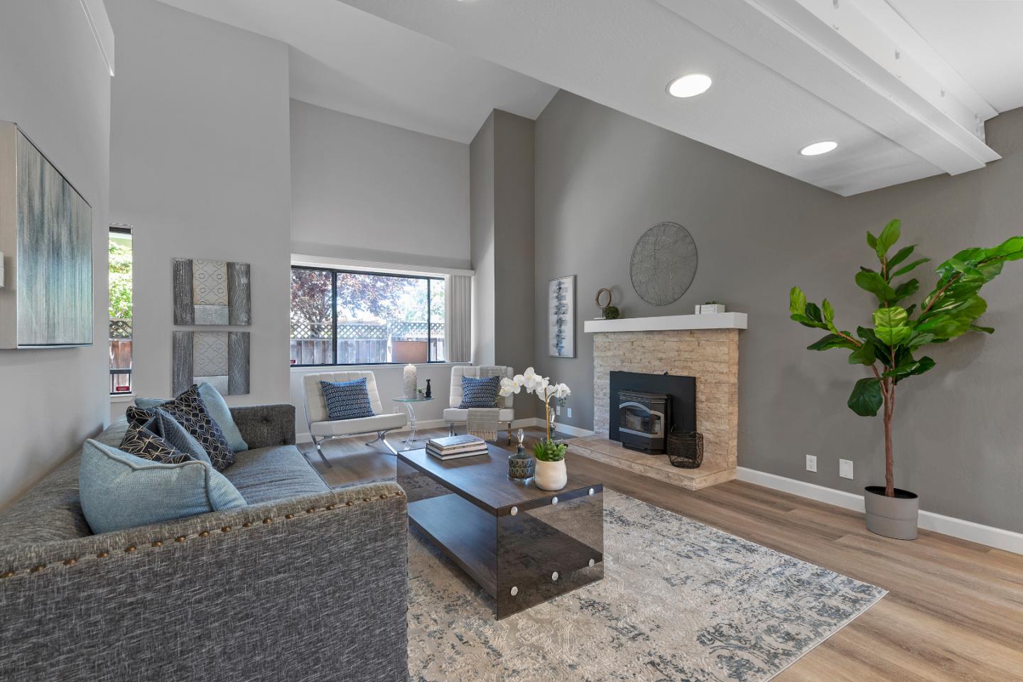 334 West Rincon Avenue Campbell, CA 95008 - Photo 6 of 25 a living room with furniture potted plant and a fireplace