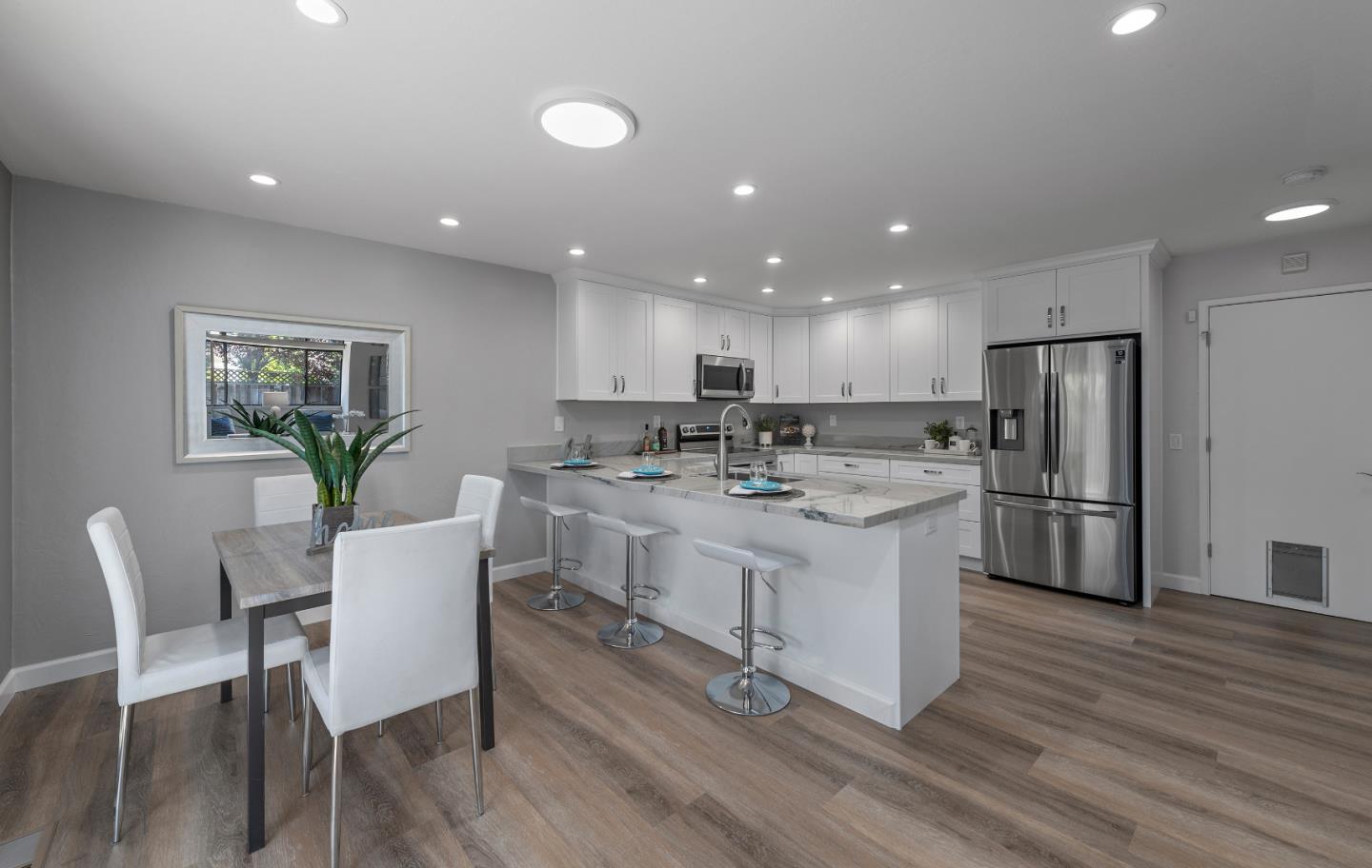 334 West Rincon Avenue Campbell, CA 95008 - Photo 8 of 25 a kitchen with a sink stainless steel appliances and white cabinets