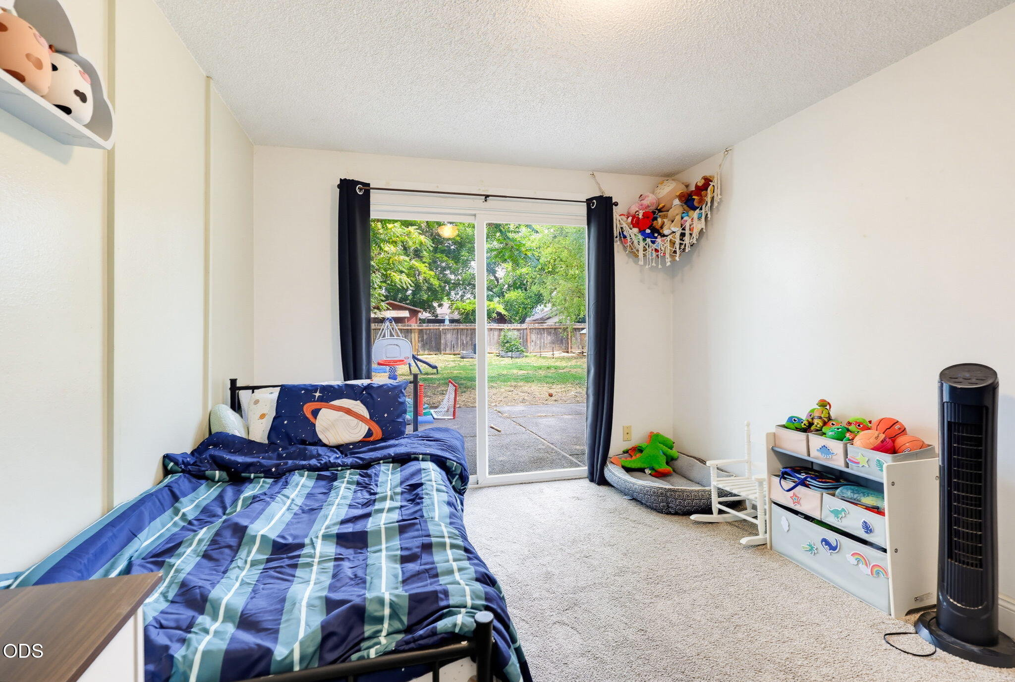 1325 Spring Street Medford, OR 97504 - Photo 18 of 27 a living room with furniture and a floor to ceiling window