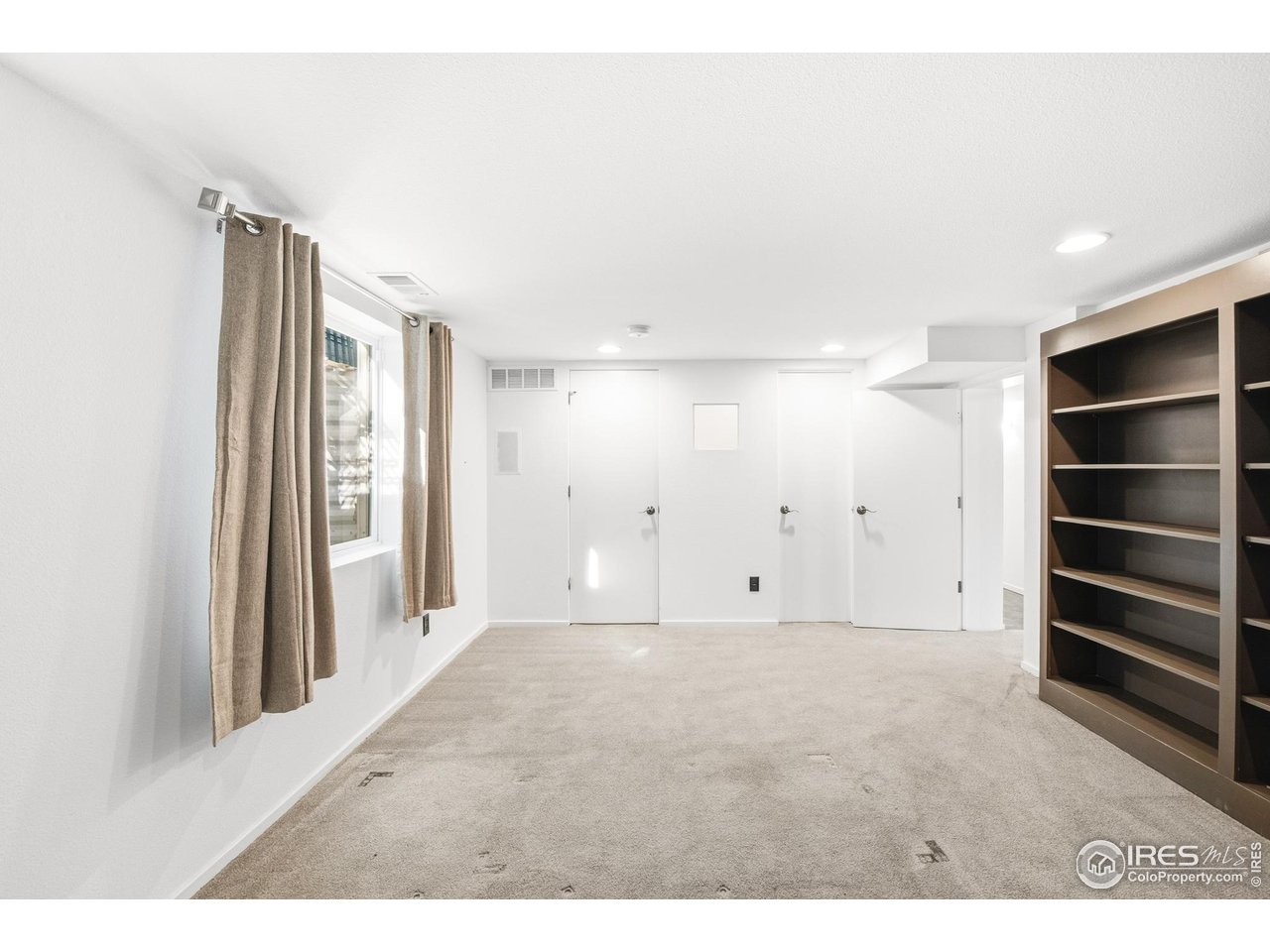 1550 Bluebell Avenue Boulder, CO 80302 - Photo 9 of 49 basement bedroom with built-in shelving
