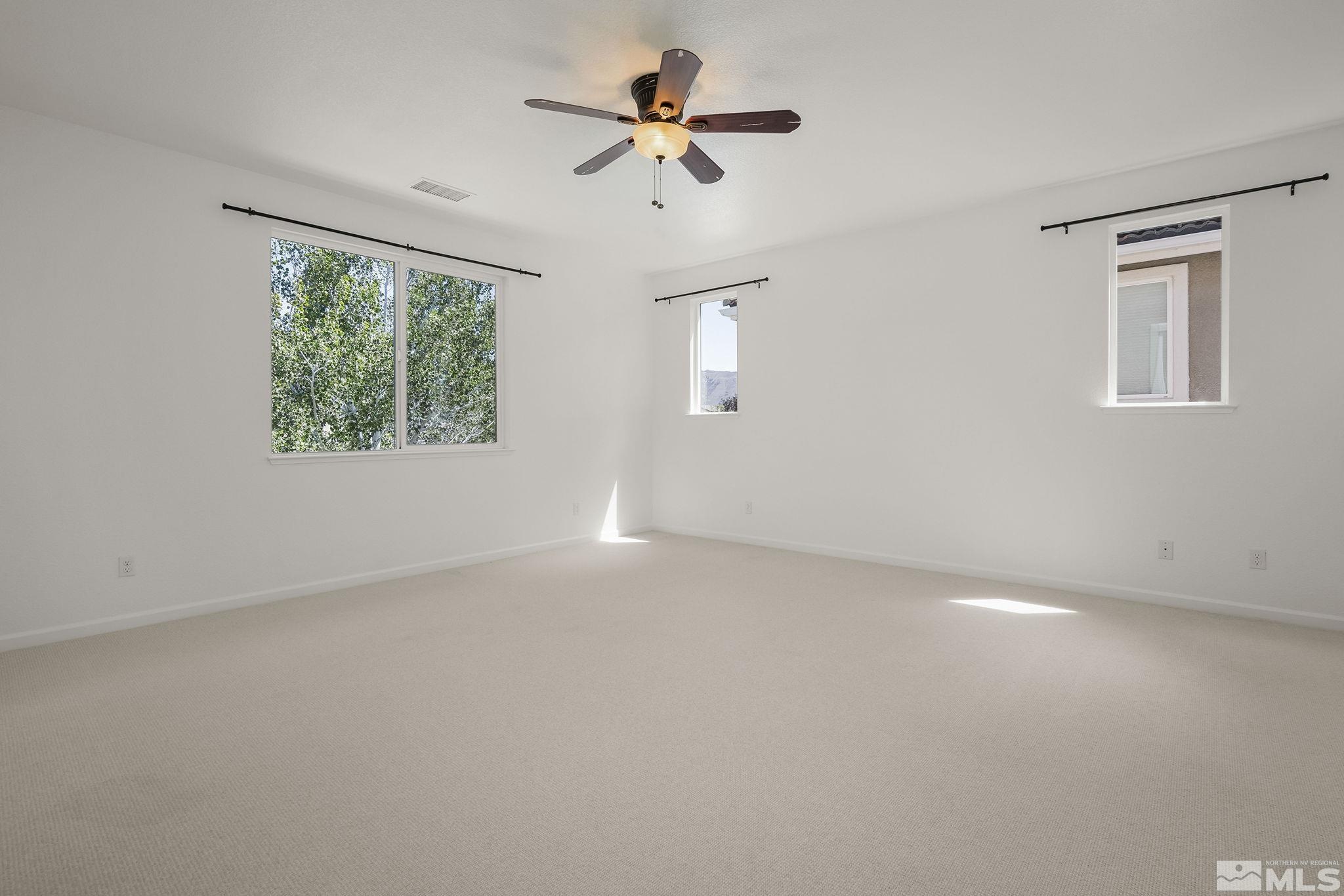 2150 Horse Prairie Road Reno, NV 89521 - Photo 15 of 31 an empty room with a window and a ceiling fan