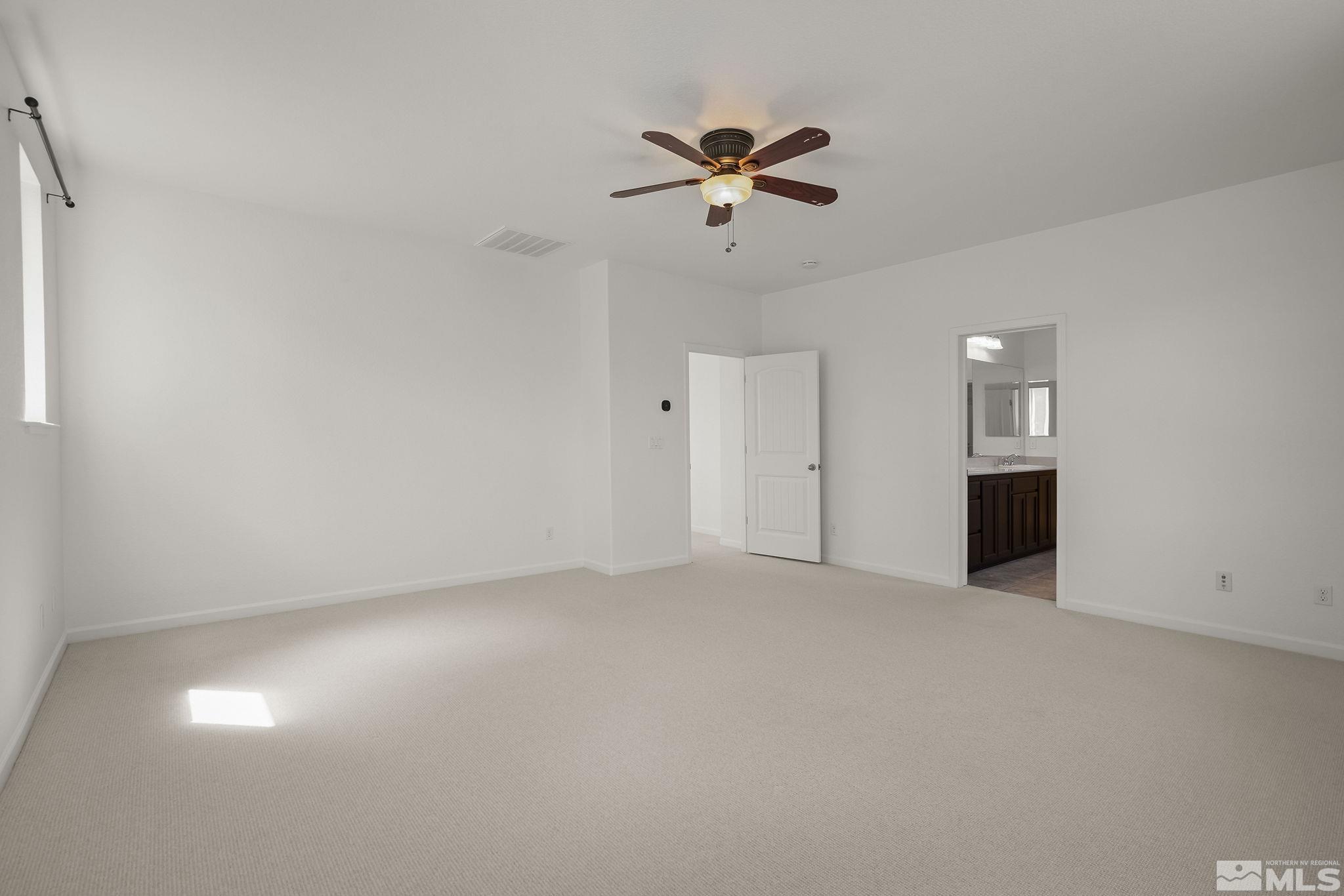 2150 Horse Prairie Road Reno, NV 89521 - Photo 16 of 31 a view of an empty room with a ceiling fan