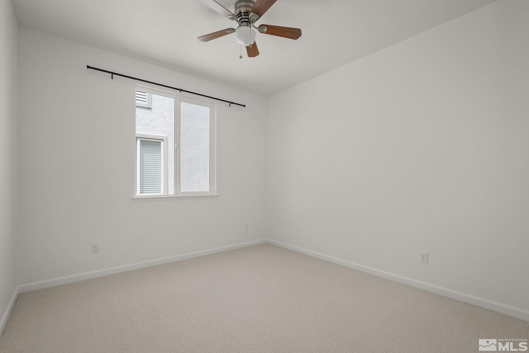 2150 Horse Prairie Road Reno, NV 89521 - Photo 22 of 31 an empty room with a window and a fan