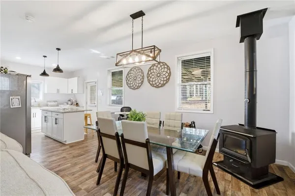 a kitchen with stainless steel appliances granite countertop a sink refrigerator and cabinets