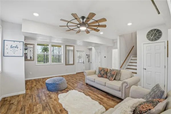 a living room with furniture and a large window