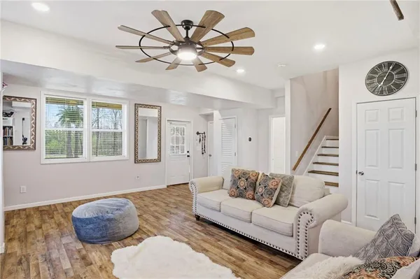 a living room with furniture and a large window