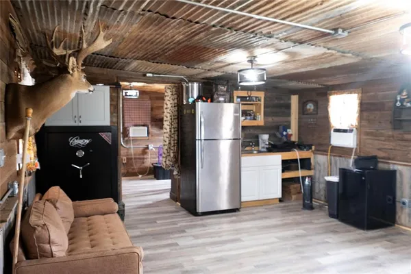 a kitchen with stainless steel appliances granite countertop a refrigerator and a stove