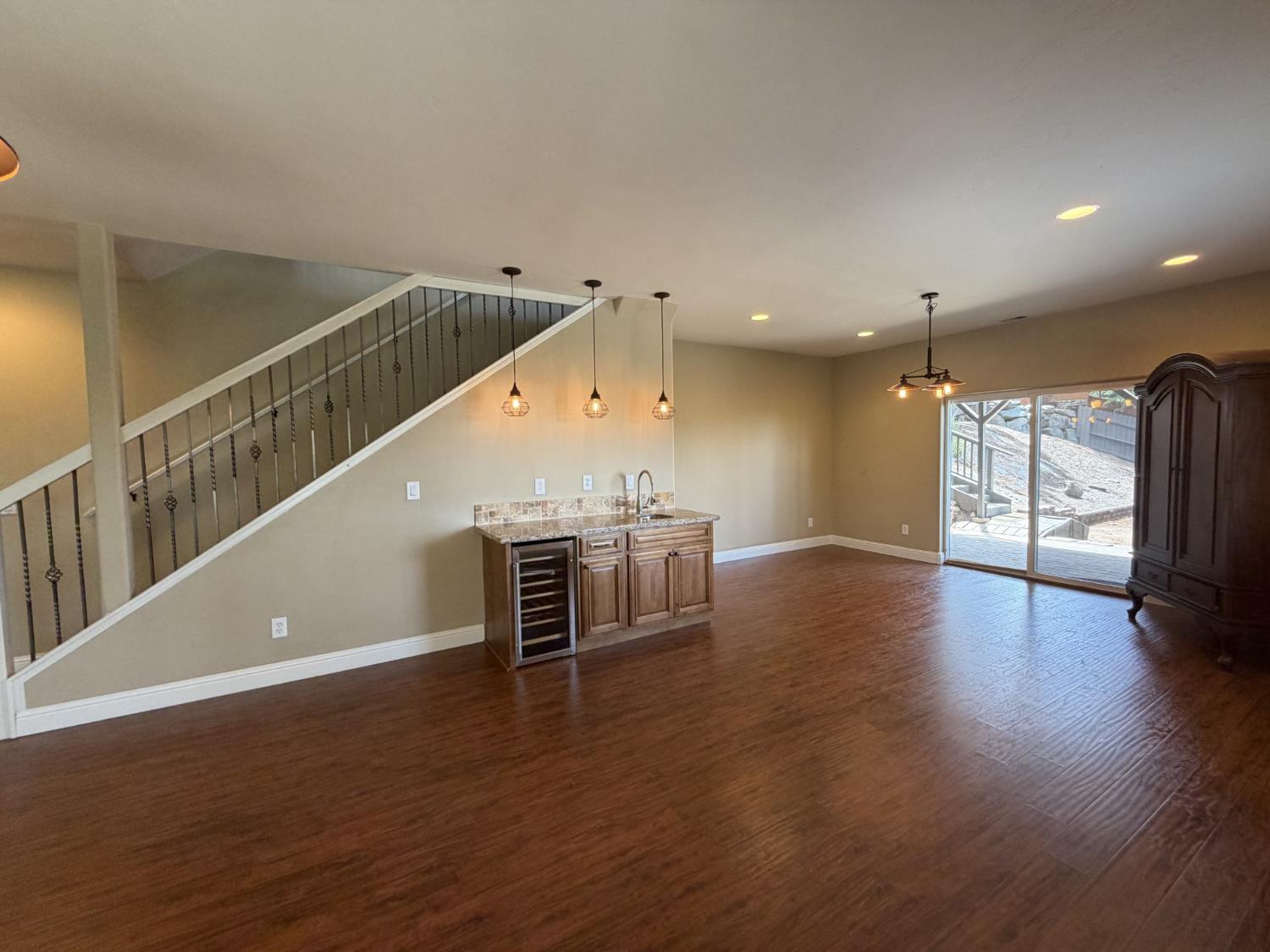 1472 Nesting Way Placerville, CA 95667 - Photo 28 of 44 lower level bar with sink and wine refrigerator