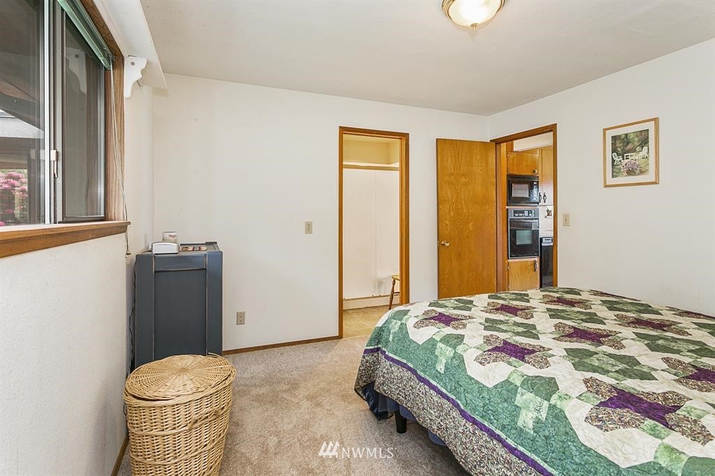 22016 High Bridge Road Monroe, WA 98272 - Photo 11 of 40 a bedroom with a bed and a window