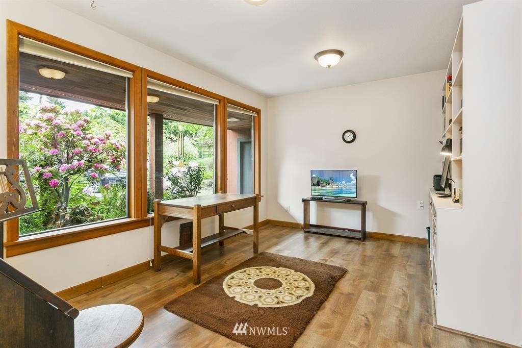 22016 High Bridge Road Monroe, WA 98272 - Photo 15 of 40 a living room with a couch a rug and a large window
