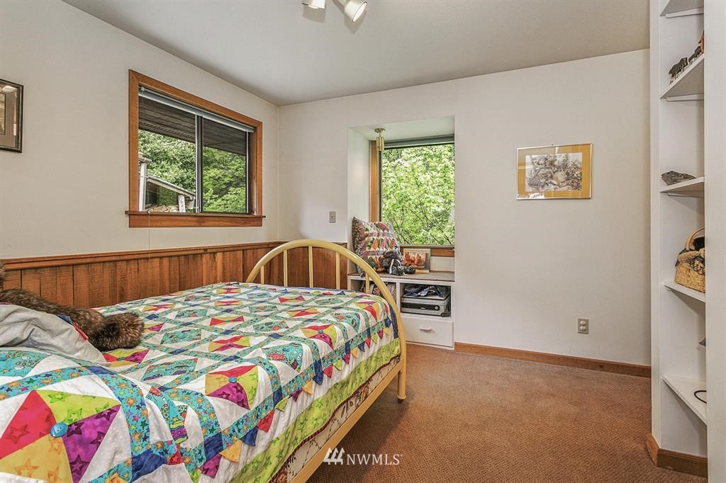 22016 High Bridge Road Monroe, WA 98272 - Photo 17 of 40 a bedroom with a bed and a window