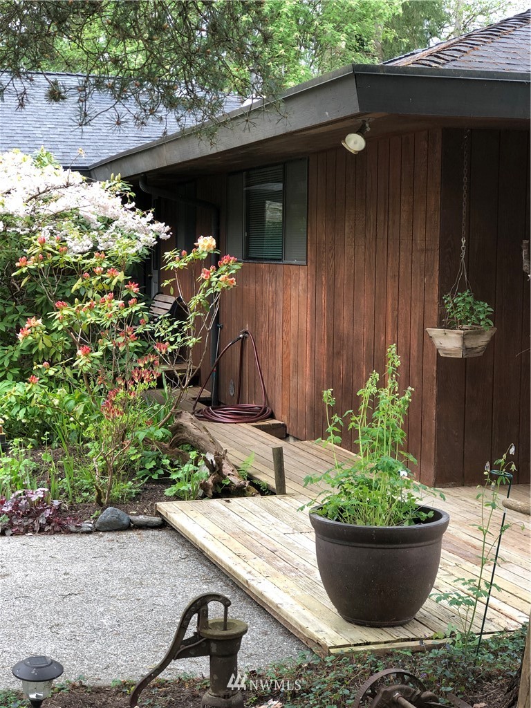 22016 High Bridge Road Monroe, WA 98272 - Photo 3 of 40 a view of a house with potted plants