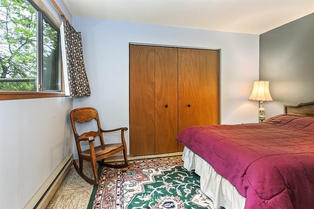 22016 High Bridge Road Monroe, WA 98272 - Photo 21 of 40 a bedroom with a bed chair and window