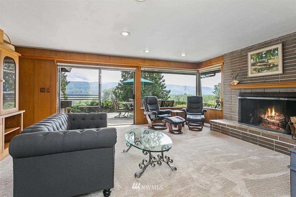 22016 High Bridge Road Monroe, WA 98272 - Photo 4 of 40 a living room with furniture and a fireplace