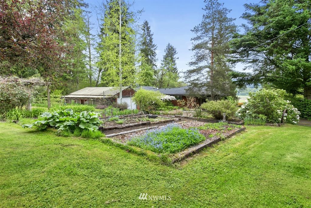 22016 High Bridge Road Monroe, WA 98272 - Photo 31 of 40 a view of a garden with a patio