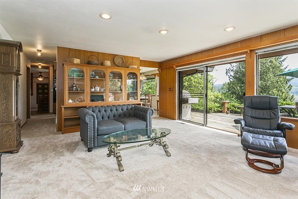 22016 High Bridge Road Monroe, WA 98272 - Photo 6 of 40 a living room with furniture and large windows