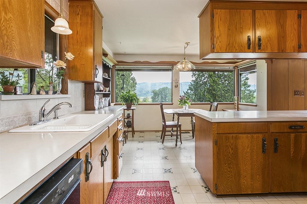 22016 High Bridge Road Monroe, WA 98272 - Photo 9 of 40 a dining table with chairs and a large window