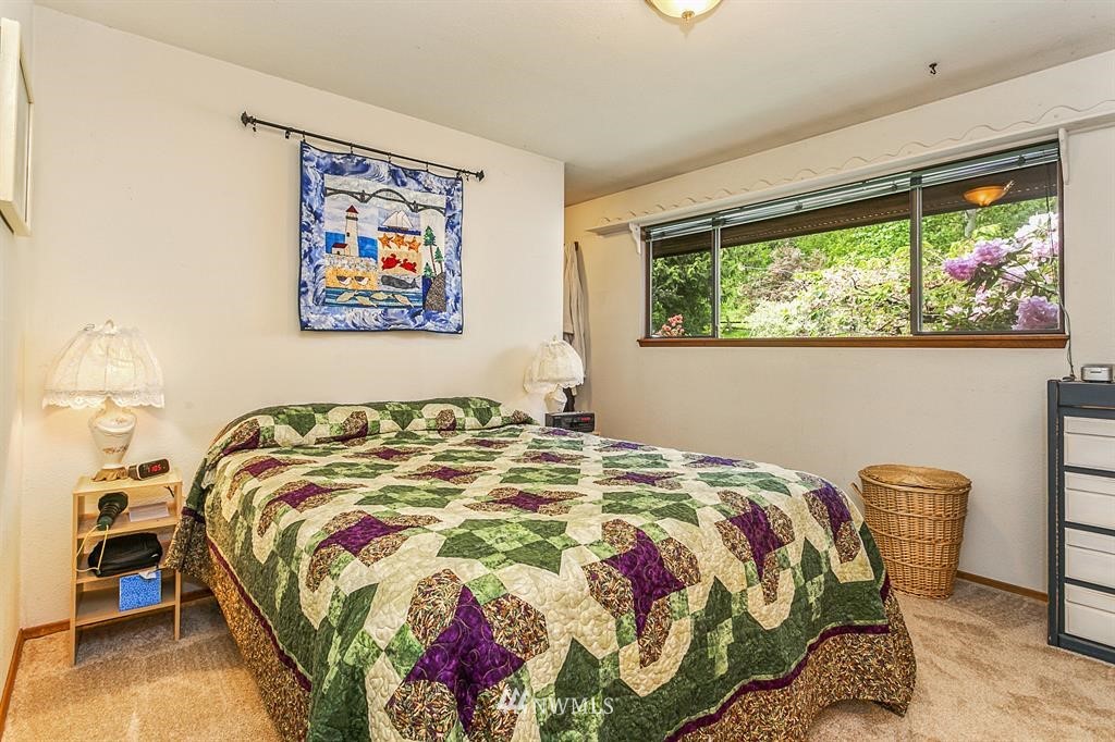 22016 High Bridge Road Monroe, WA 98272 - Photo 10 of 40 a bed sitting in a bedroom next to a window