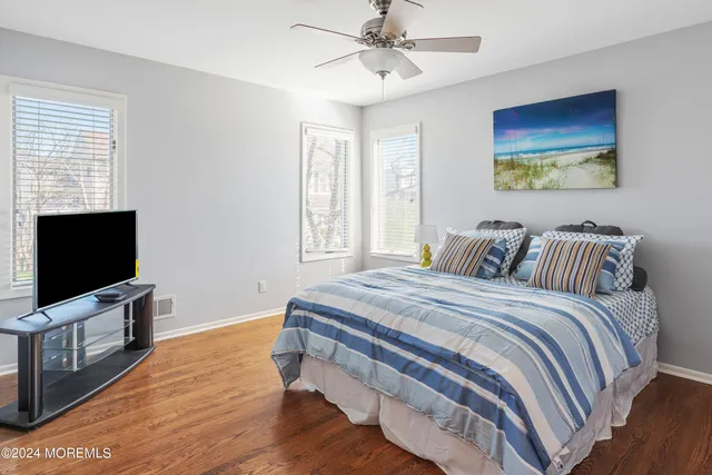 a bedroom with a bed and a lamp