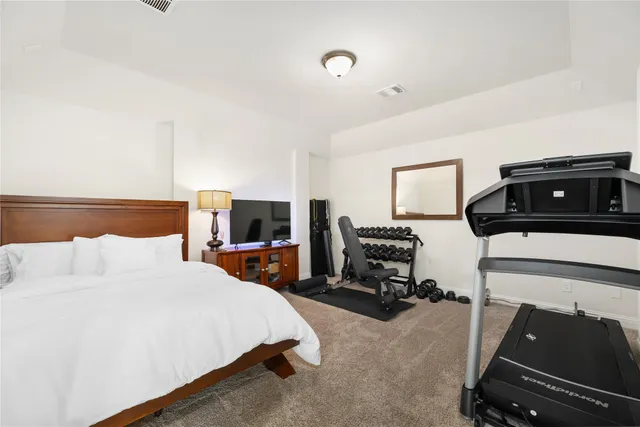 a bedroom with a bed and furniture