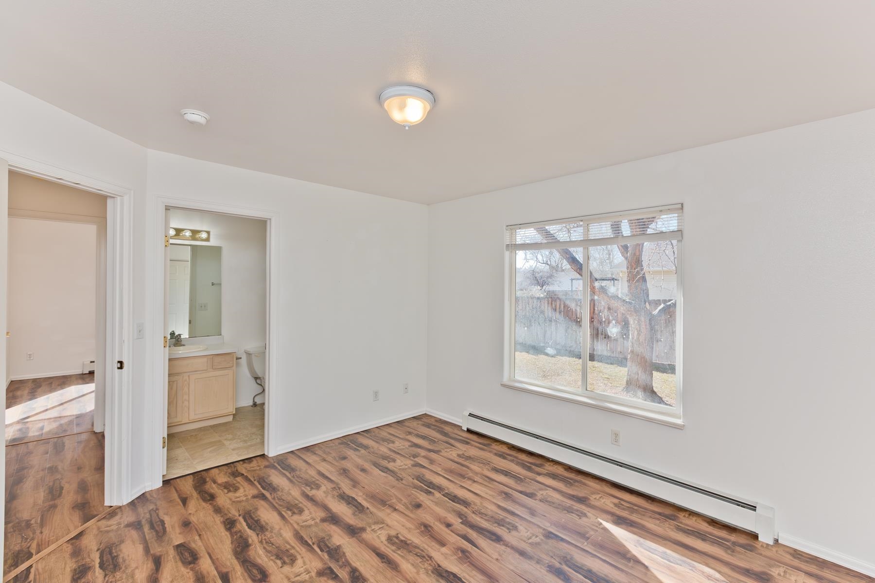 513 April Lane, Unit A Grand Junction, CO 81504 - Photo 18 of 31 an empty room with windows and closet