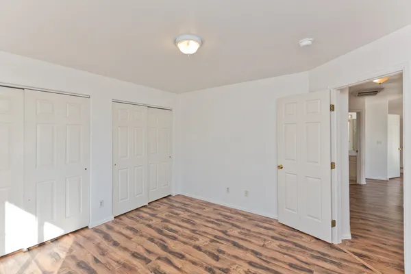 a white toilet sitting next to a bath tub