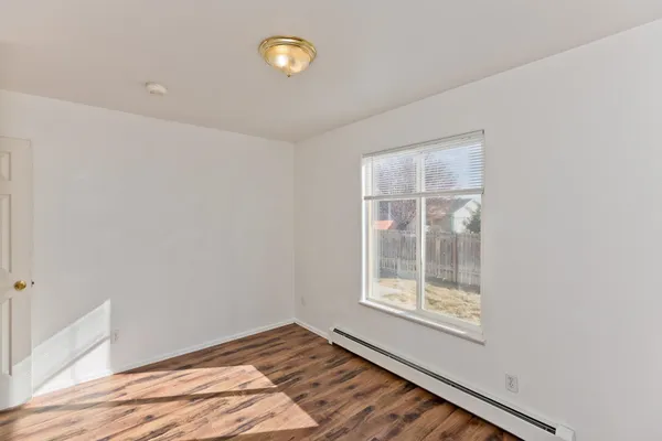 a view of small space with wooden floor