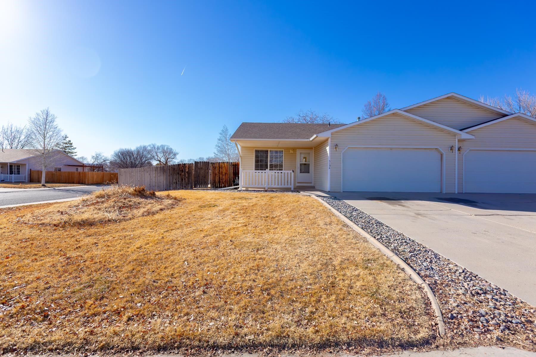 513 April Lane, Unit A Grand Junction, CO 81504 - Photo 3 of 31 a view of a house with a yard