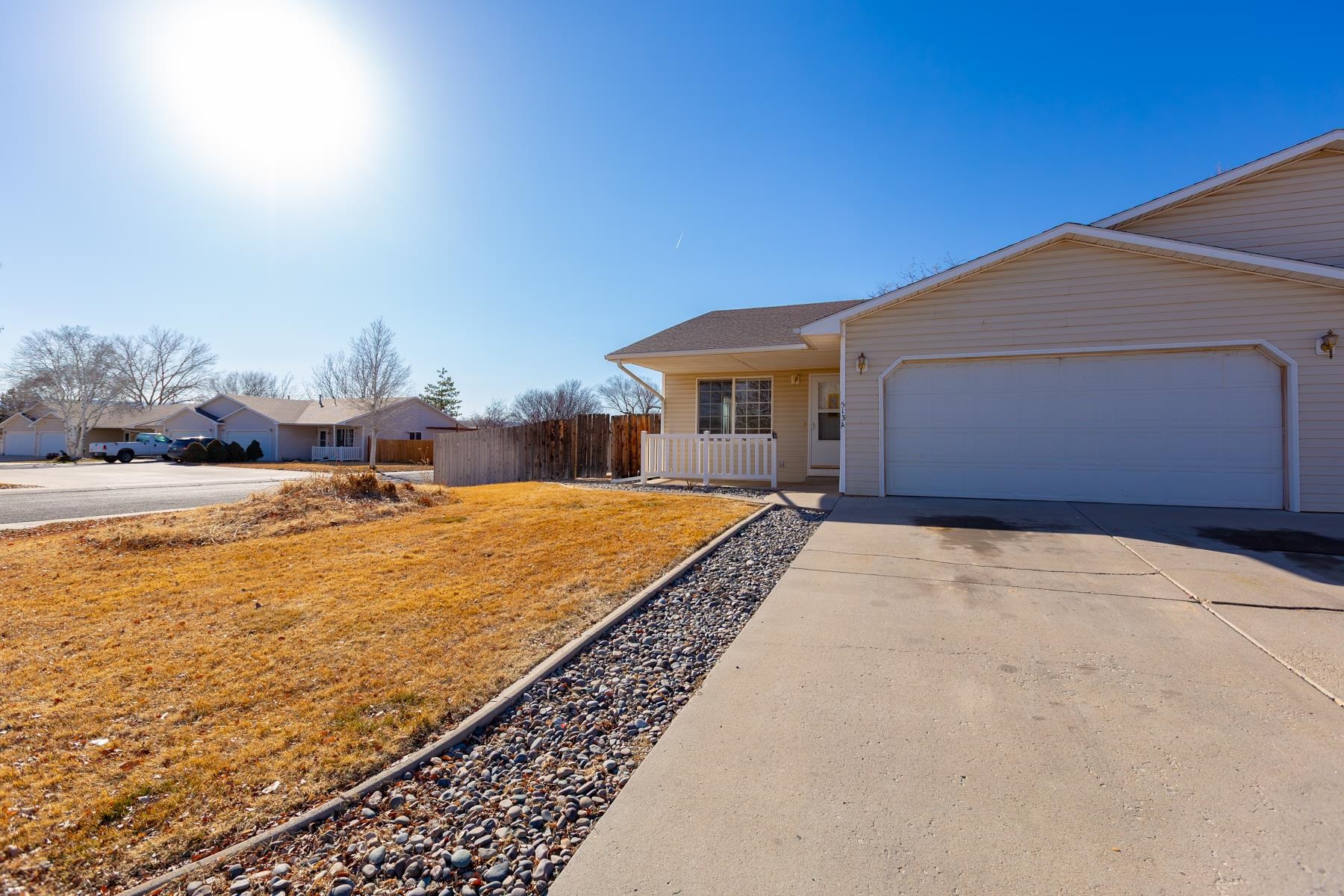 513 April Lane, Unit A Grand Junction, CO 81504 - Photo 4 of 31 a house with swimming pool in front of it