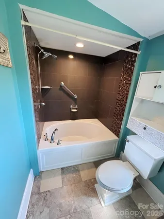 a bathroom with a sink and toilet