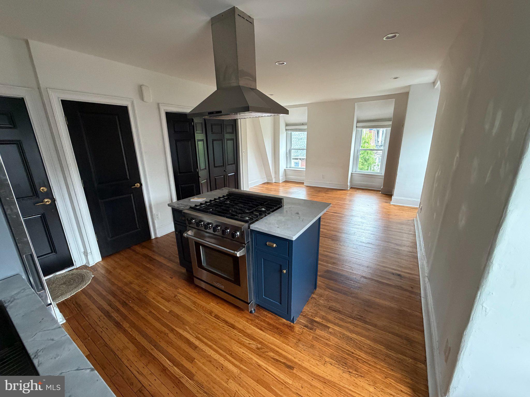 815 South 49th Street Philadelphia, PA 19143 - Photo 38 of 72 a kitchen with granite countertop a stove and a sink
