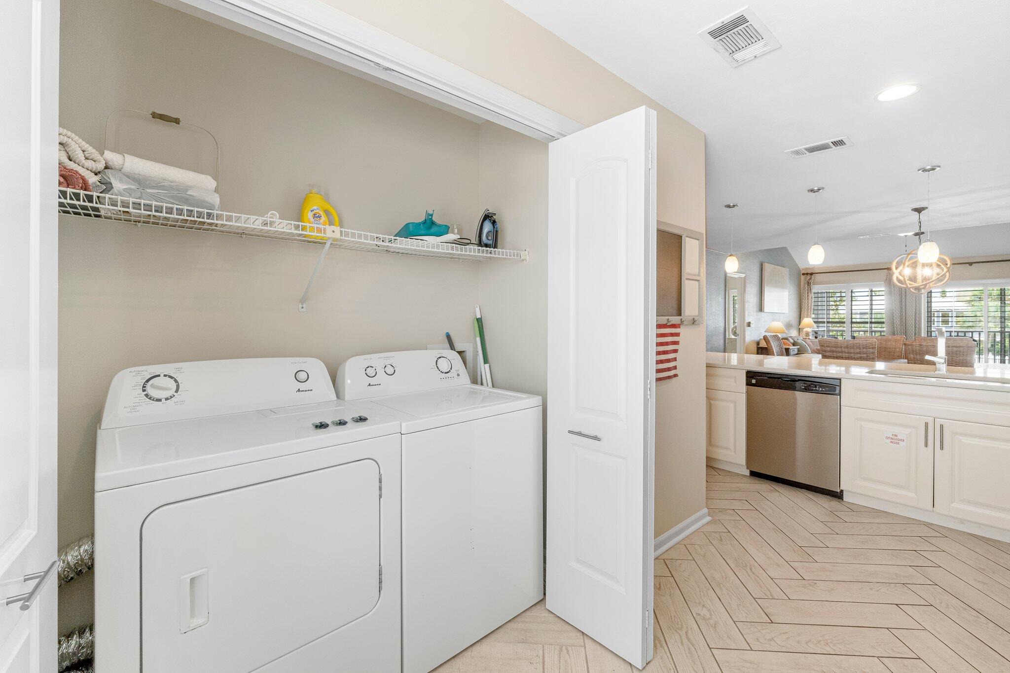 4984 West County Highway 30A Road, Unit 7B Santa Rosa Beach, FL 32459 - Photo 14 of 40 a view of washer and dryer with kitchen in the background