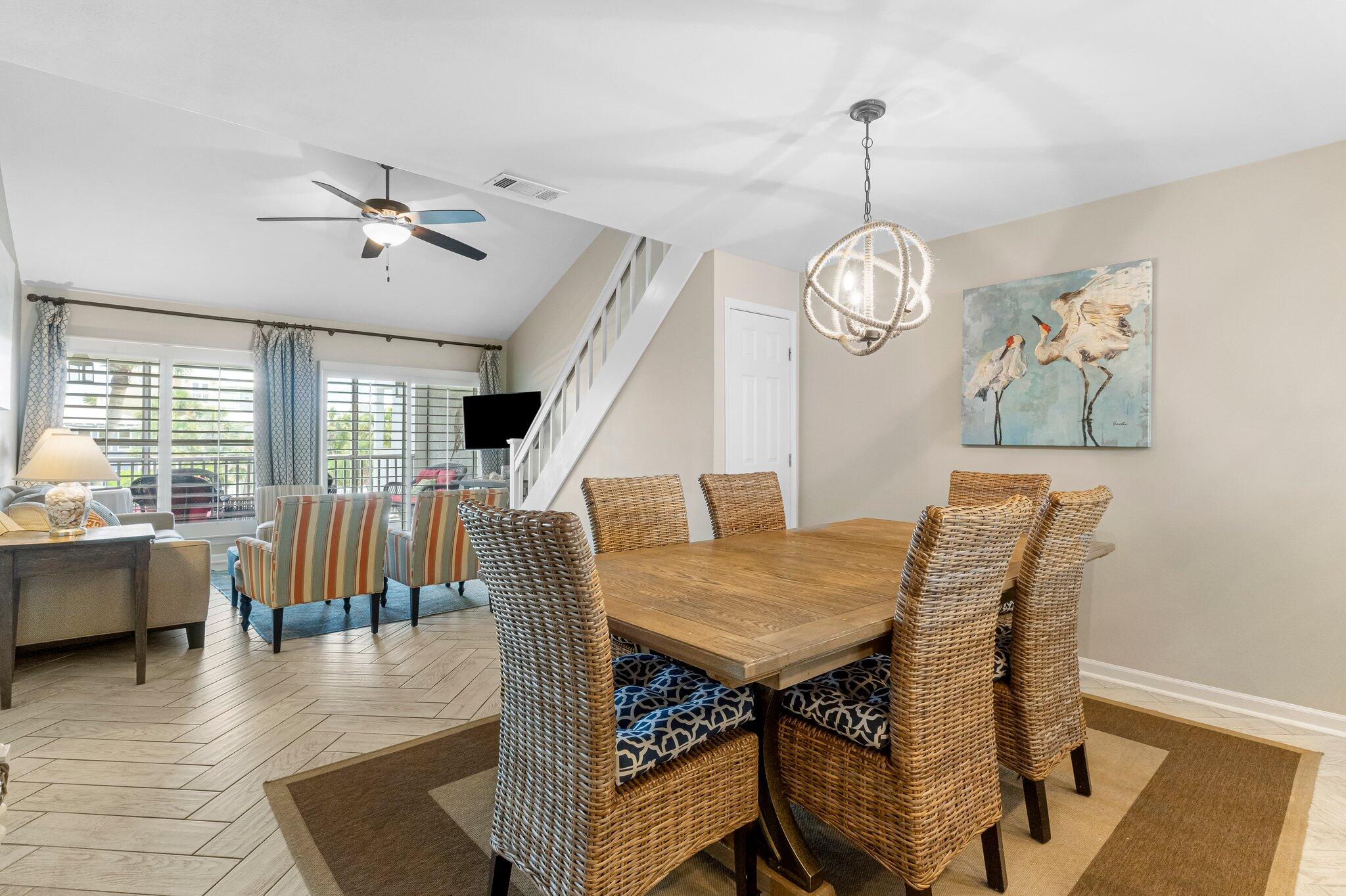 4984 West County Highway 30A Road, Unit 7B Santa Rosa Beach, FL 32459 - Photo 15 of 40 a view of a dining room with furniture window and wooden floor
